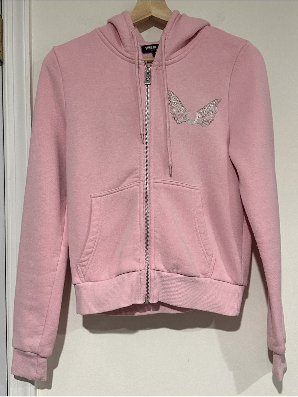 True Religion pink zip up hoodie with silver rhinestone angel wings
